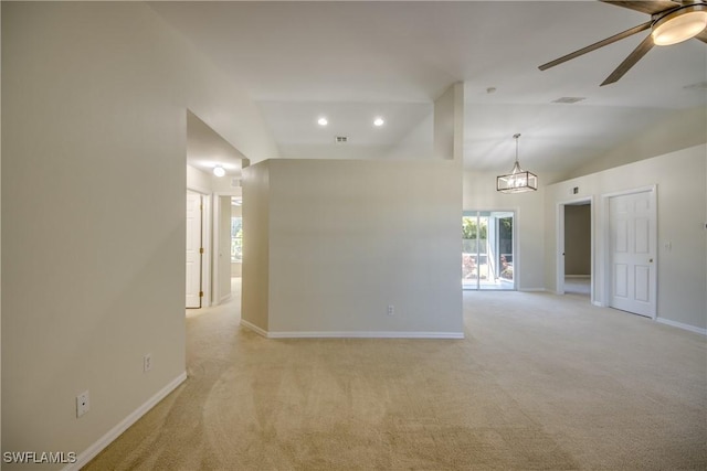 unfurnished room with baseboards, vaulted ceiling, light carpet, recessed lighting, and a ceiling fan