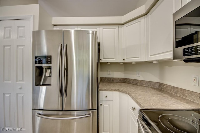 kitchen featuring white cabinets and stainless steel appliances