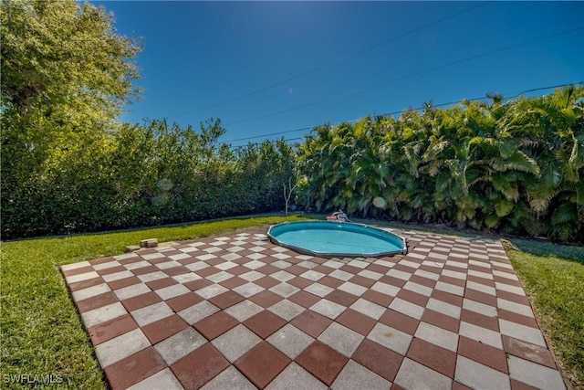 pool with a patio area