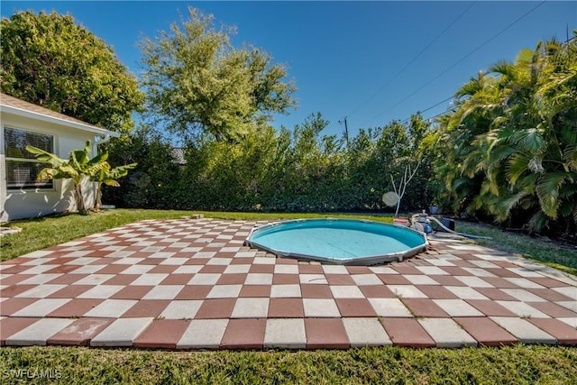 outdoor pool featuring a patio area