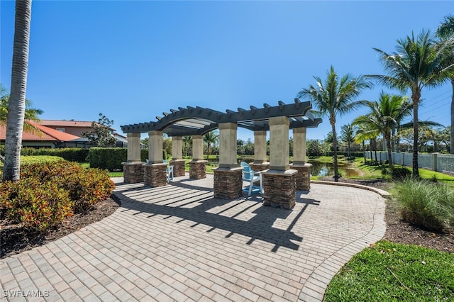 view of patio / terrace with a pergola and fence