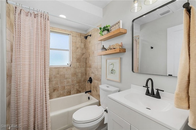 full bathroom featuring vanity, toilet, visible vents, and shower / bath combo with shower curtain