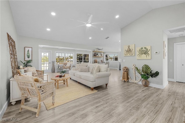 living room with baseboards, ceiling fan, light wood-type flooring, recessed lighting, and high vaulted ceiling