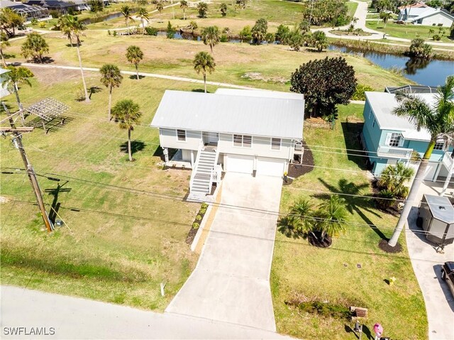 drone / aerial view with a water view