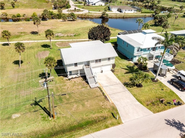 drone / aerial view with a water view