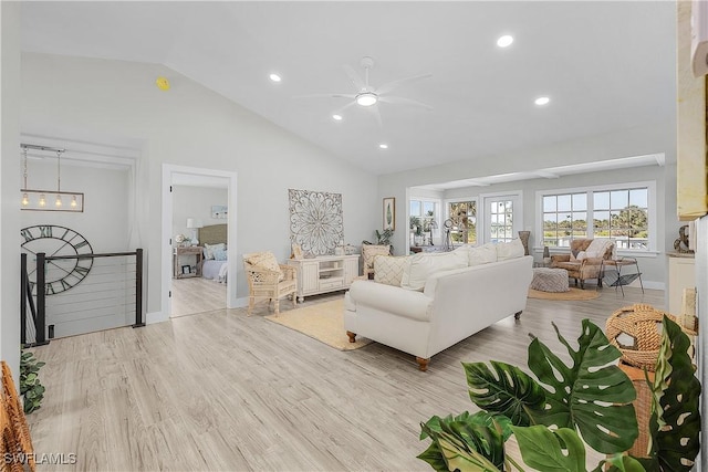 living area with wood finished floors, baseboards, high vaulted ceiling, recessed lighting, and ceiling fan