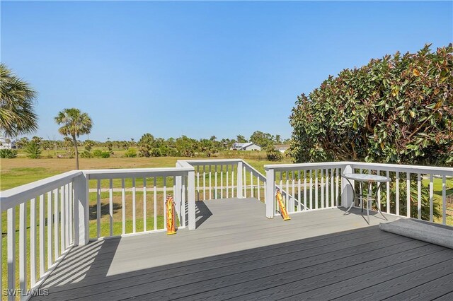 wooden terrace featuring a rural view