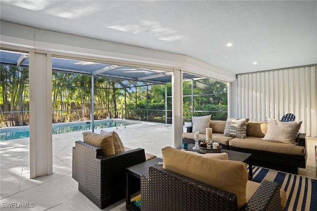 living room featuring recessed lighting and a sunroom