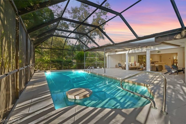 145 Forestwood Dr, Naples, FL 34110 - outdoor pool featuring a patio area, an outdoor living space, and glass enclosure