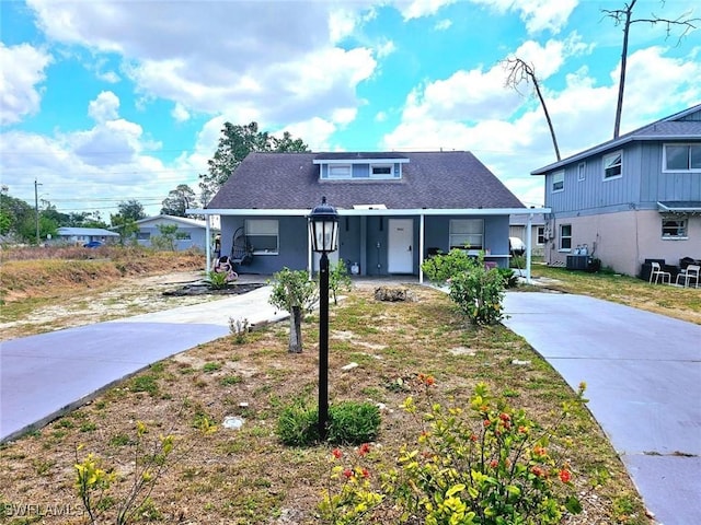 5529/5531 10th Ave, Fort Myers, FL 33907 - bungalow-style home featuring driveway, central AC unit, and a shingled roof