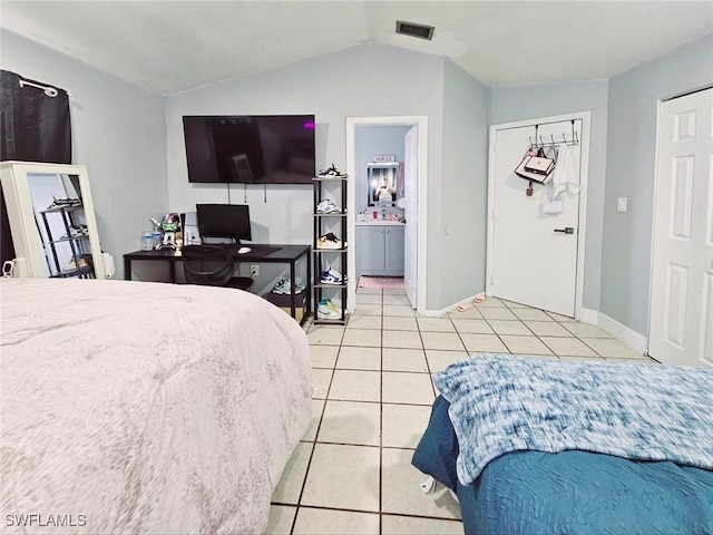 5529/5531 10th Ave, Fort Myers, FL 33907 - bedroom with light tile patterned floors, lofted ceiling, and baseboards