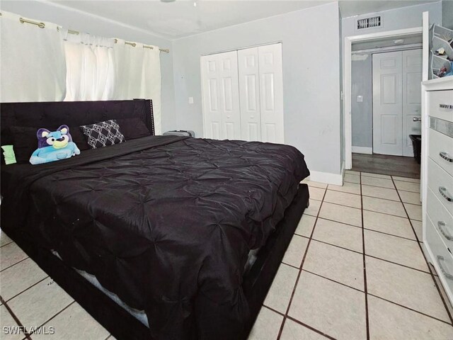 5529/5531 10th Ave, Fort Myers, FL 33907 - bedroom featuring light tile patterned floors, a closet, and baseboards