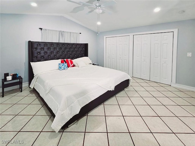 5529/5531 10th Ave, Fort Myers, FL 33907 - bedroom with light tile patterned floors, vaulted ceiling, baseboards, multiple closets, and a ceiling fan