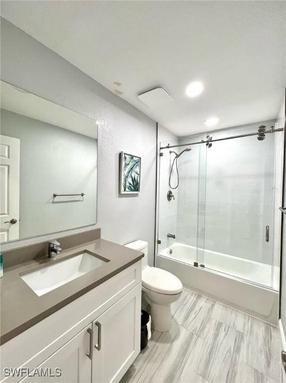 full bath featuring recessed lighting, bath / shower combo with glass door, vanity, and toilet