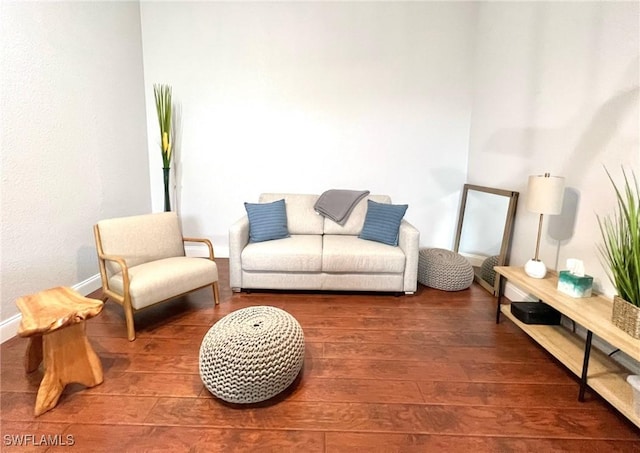 living room with wood finished floors and baseboards