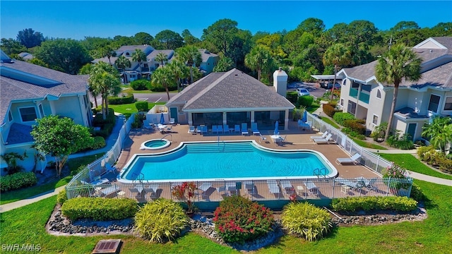 pool featuring fence and a patio area