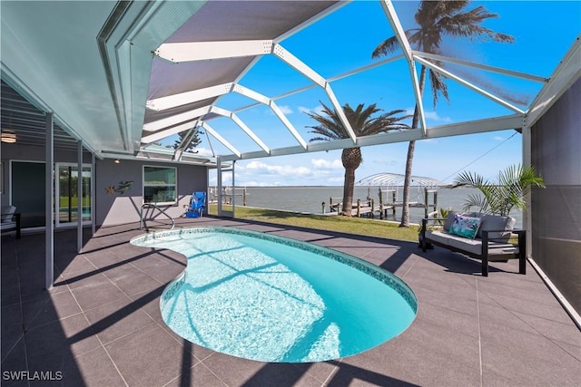 pool featuring a lanai and a patio area