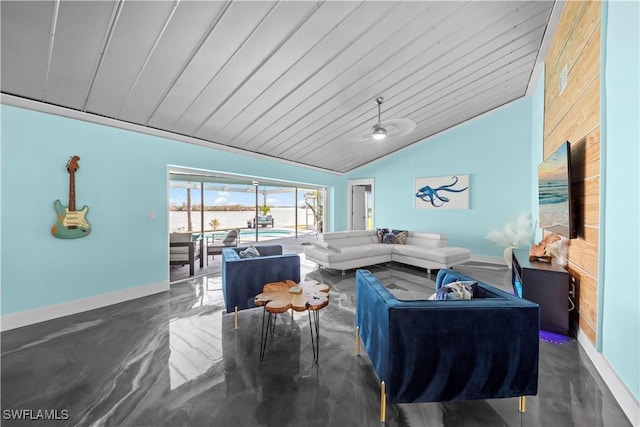 living room with baseboards, lofted ceiling, and finished concrete floors