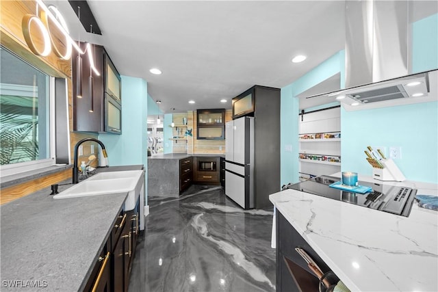 kitchen with freestanding refrigerator, a sink, glass insert cabinets, exhaust hood, and marble finish floor