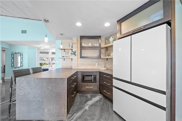 kitchen with backsplash, built in microwave, a peninsula, marble finish floor, and open shelves