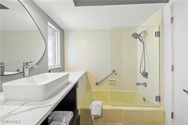 bathroom featuring vanity and washtub / shower combination