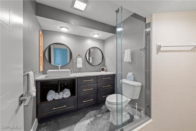 bathroom featuring an enclosed shower, toilet, and vanity