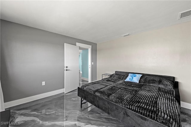 bedroom featuring visible vents, baseboards, and finished concrete floors