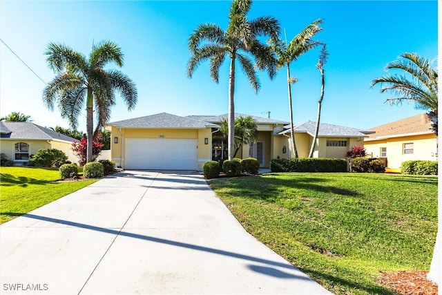 ranch-style home featuring stucco siding, an attached garage, concrete driveway, and a front yard