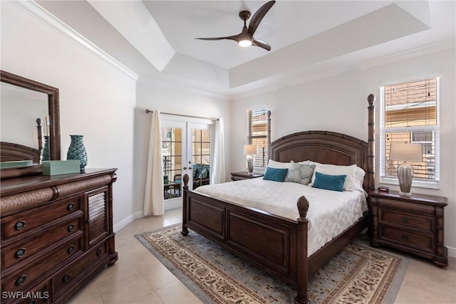 bedroom with baseboards, ceiling fan, french doors, a raised ceiling, and access to outside