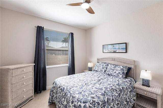 bedroom featuring baseboards and ceiling fan