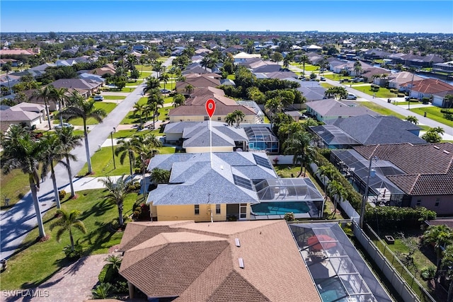 birds eye view of property with a residential view