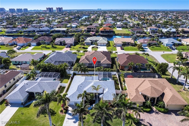 birds eye view of property featuring a residential view and a water view