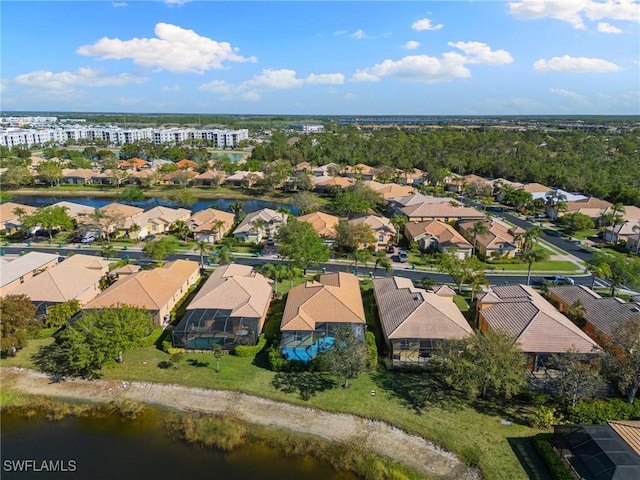 drone / aerial view featuring a residential view and a water view