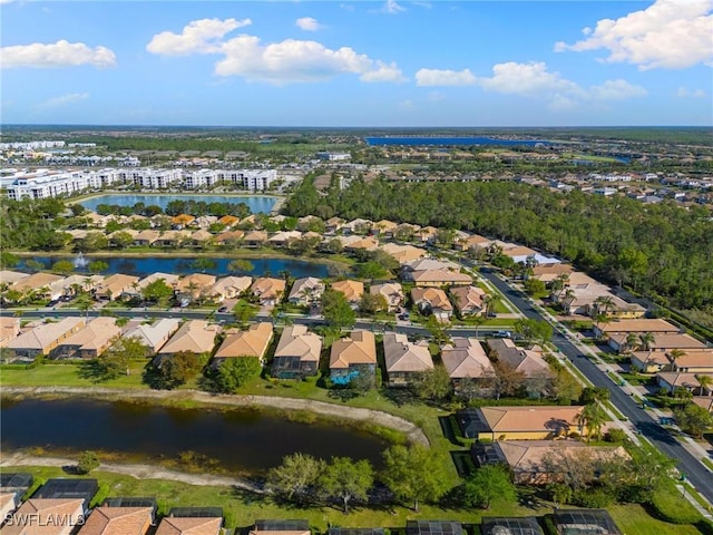 bird's eye view with a residential view and a water view