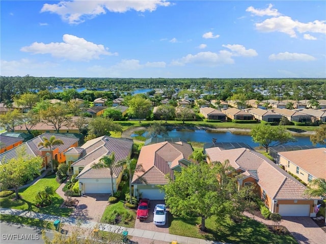 birds eye view of property with a residential view and a water view