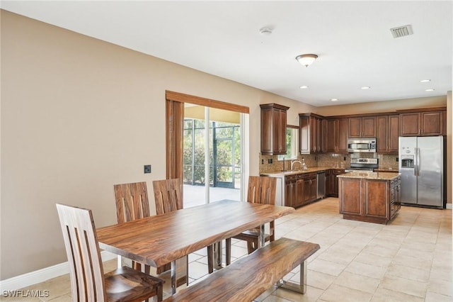 dining area featuring baseboards, visible vents, recessed lighting, and light tile patterned floors
