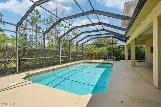 outdoor pool with a lanai and a patio