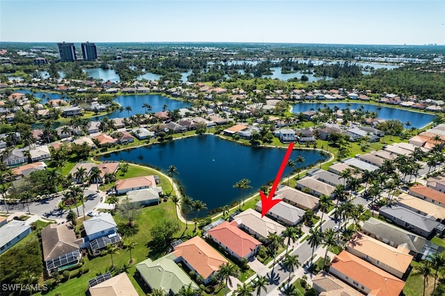 birds eye view of property featuring a residential view and a water view