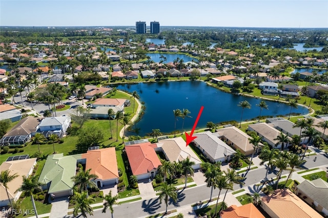 aerial view featuring a residential view and a water view