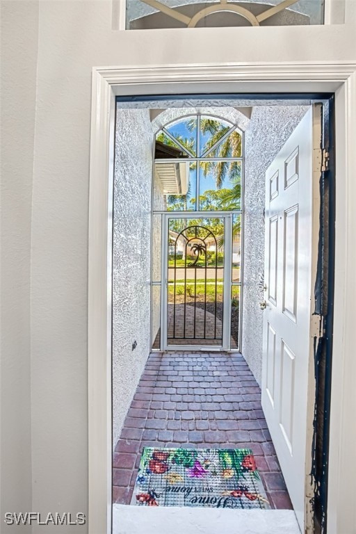 entrance to property with stucco siding