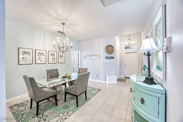 dining area with an inviting chandelier, light tile patterned floors, baseboards, and visible vents