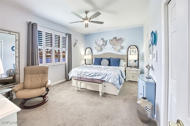 bedroom featuring light colored carpet and a ceiling fan