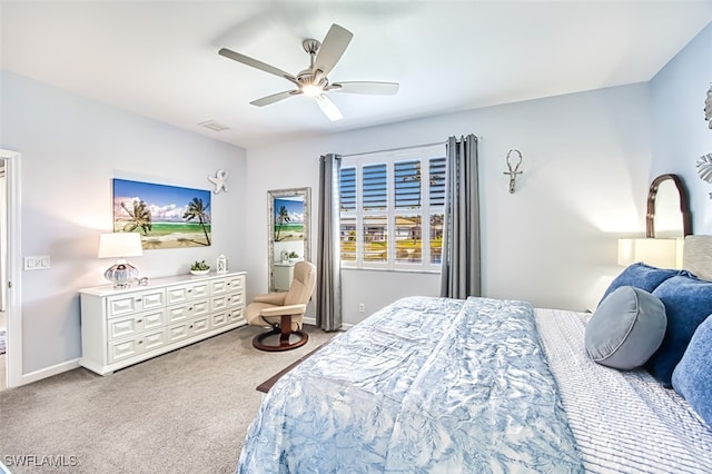 bedroom featuring visible vents, baseboards, a ceiling fan, and carpet floors