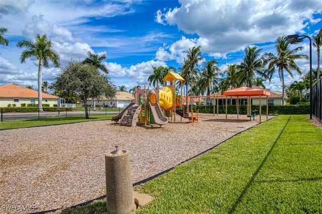 community playground featuring a yard