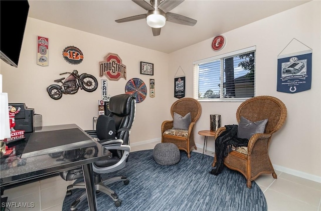 tiled home office with a ceiling fan and baseboards