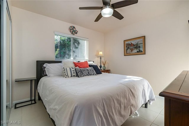 bedroom with light tile patterned floors, baseboards, and ceiling fan