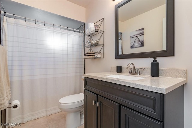 bathroom featuring curtained shower, toilet, vanity, and tile patterned flooring