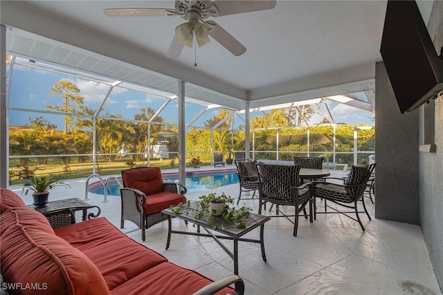 sunroom / solarium with a wealth of natural light and a ceiling fan