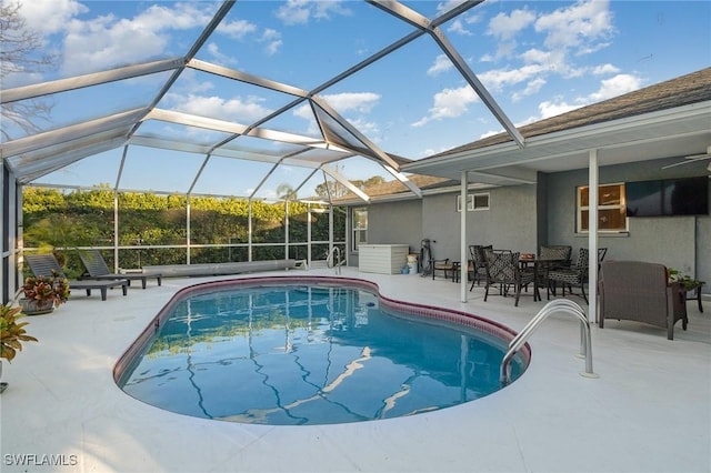 outdoor pool featuring a patio and a lanai