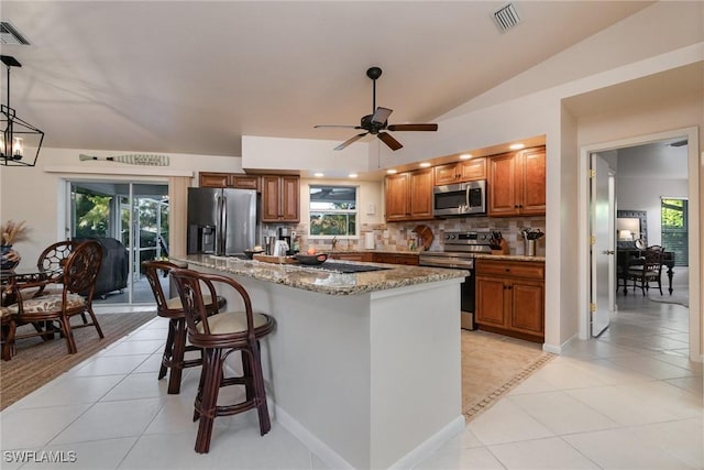 kitchen featuring light tile patterned flooring, visible vents, and appliances with stainless steel finishes